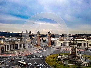 Font magica de montjuic at placa de espana in Barcelona evening afternoon sunlight warm clear sky two towers castle fort