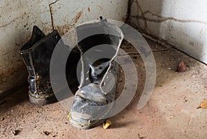 Font view from pair of old boots inside a old house