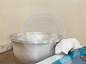 Font with water for baptism in Orthodoxy