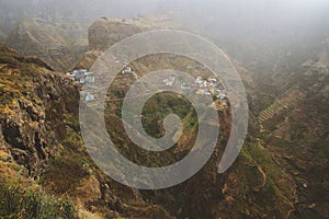 Fontaihas village. Settlement in the rocky coast of Santo Antao island. Houses nestle into the bluff ridge wall