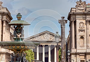 Fontain and Madeleine church in Paris photo