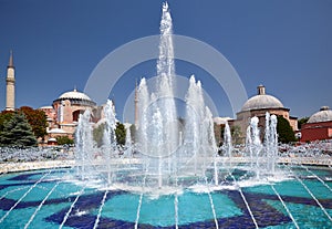 The fontain in Sultan Ahmet Park with Hagia Sophia in the backg