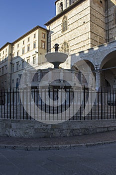 Fontana Maggiore fountain in Perugia with Duomo Cathedral behind