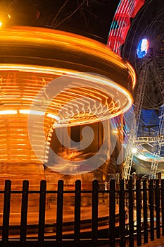 Fonte Nova`s garden with Christmas market and colored ferris wheel near Ria de Aveiro at night