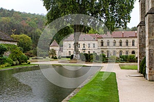 Fontenay Abbey in France. Image of lake and lodgings.