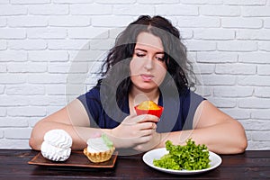 Food addiction, dieting concept. Young overweight woman fighting