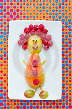 Food art idea for kids - pear and raspberry funny man