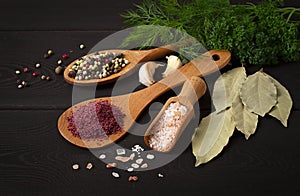 Assortment of spices ,on a woden black background, top view, horizontal, no peope, photo