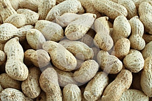 Food background - big peanuts in shells situated arbitrarily