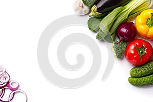 Food background border frame of colorful fresh produce raw vegetables, cucumber purple cabbage spinach tomatoes paprika onion