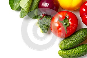 Food background border frame of colorful fresh produce raw vegetables, cucumber purple cabbage spinach tomatoes paprika onion