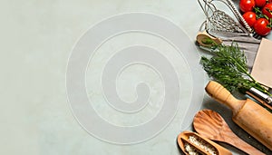 Food background with food and kitchen utensils viewed from above with a free space to put text.
