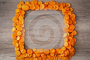 Food background frame of carrot slices