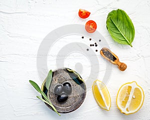 Food background with fresh herbs tomato ,lemon slice , black pe