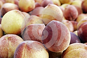 Food background of fresh peaches as viewed close up