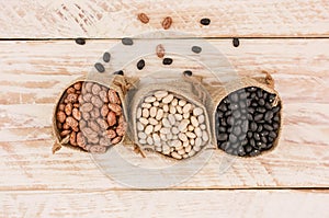 Food background of healthy dried black,brown and white  beans