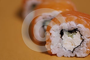 Food background. Orange rolls on an orange background.