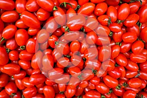 Food background. plum cherry tomatoes top view pattern