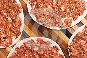 Food background of prepared uncooked lahmacun photo