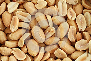 Food background - salted roasted peanuts situated arbitrarily
