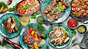 Food background. Set of traditional Turkish and Oriental cuisine. Set of meat and vegetable dishes in plates.