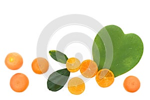 Food background with small tangerines and heart