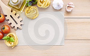 Food background for tasty Italian dishes with blank brown paper and vintage pasta ladle on wooden background. Top view italian