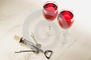 Food background with Wine and corkscrew/Food background with two red Wine and corkscrew. Top view