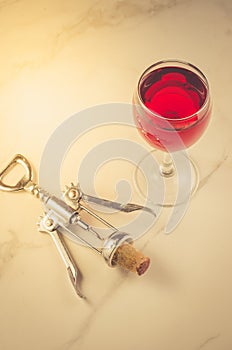 Food background with Wine glass and corkscrew/Food background with red Wine glass and corkscrew. Top view