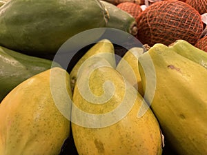 Food backgrounds Grocery store produce department Papaya fruits display