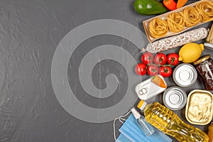 Food bank, food delivery concept. Food and medicine donations on gray concrete background with copy space - pasta, fresh