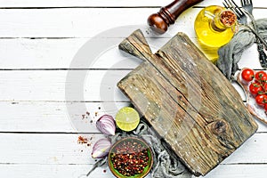 Food banner. Spices, vegetables and herbs on a white wooden background. Top view.