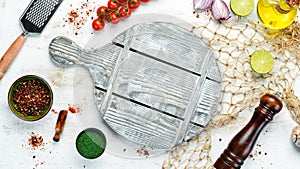 Food banner. Spices, vegetables and herbs on a white wooden background. Top view.