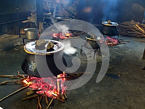 Food being cooked in cauldrons