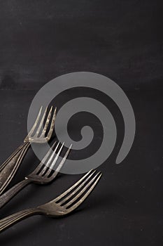 Food black background and vintage forks