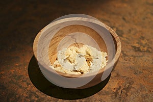 Food is in a bowl made of wood. Food containers for prisoners in prisons in the past.