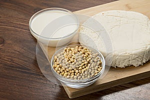 Food : Bowls of Soy Milk,Soybeans and Tofu Isolated on Wooden Background