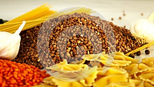 Food: buckwheat, spaghetti, pasta and lentils on the table