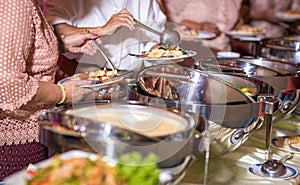 Food Buffet Catering Dining Eating Party Sharing Concept.people group catering buffet food indoor in luxury restaurant with meat c