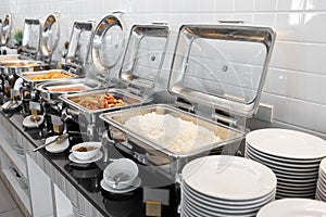 Food on buffet table with dishware