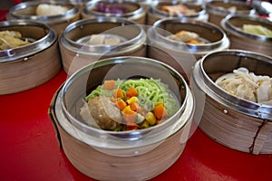 Food Chinese dim sum in a bamboo steamer box sphere,Concept:Traditional Asian appetizer culture,Delicious China food festival menu