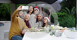 Food, christmas lunch and a family selfie together at a table for a social gathering, celebration event or bonding. Kids