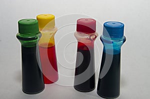 Food coloring bottles on white