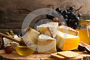 Food composition with blocks of moldy cheese, pickled plums, hon