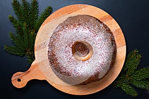 Food Concept homemade Gugelhupf, Guglhupf, Kugelhopf, kouglof bundt yeast cake of Central Europe on black background