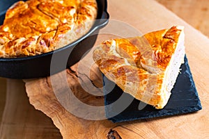 Food concept homemade pork pie or meat pie on stone plate and ca