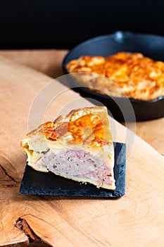 Food concept homemade pork pie or meat pie on stone plate and ca
