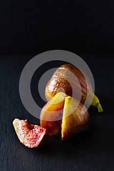 Food Concept organic figs on black slate board with copy space