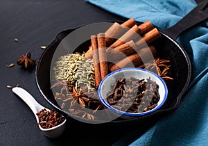 Food concept origin Chinese Five Spice  Star Anise, Fennel Seeds, Szechuan Peppercorns, Whole Cloves and Cinnamon Stick on black