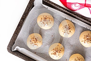 Food concept Proving, Proofing yeast dough of hamburger buns in bake pan before baking